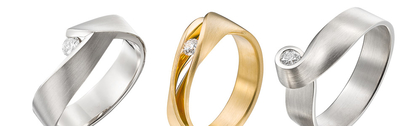 drie gouden ringen met diamant